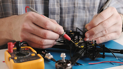 Masrter Cheching Circuit Connection On Microchip Board In Service Center, Hobby FPV Drone Assembling Process