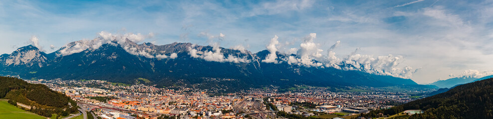 High resolution stitched alpine summer panorama with cloudy Nordkette mountains in the background...