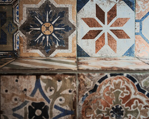 Fototapeta na wymiar colorful vintage decorative tiles photographed in the historic center of Ortigia-Syracuse