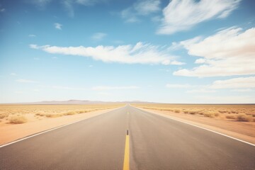 desolate road stretching into an empty horizon - obrazy, fototapety, plakaty