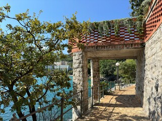 Stone walkway overlooking a peaceful body of water