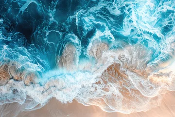 Fototapeten Aerial view of a beach with a blue wave © BrandwayArt