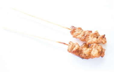 roasted slice chicken dressing Japanese teriyaki sauce stabbing wooden stick on white background