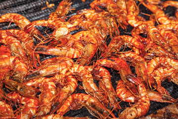 Grilled red shrimp with sauce, close-up.