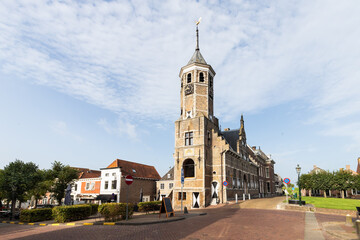 Old town hall with tower in the Dutch fortified city of Willemstad in the province of North Brabant.
