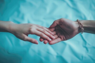 Love's Embrace: A Couple's Hands Touching Softly in Front of a Pastel Blue Background, Evoking Romance and Intimacy with a Generous Copy Space



