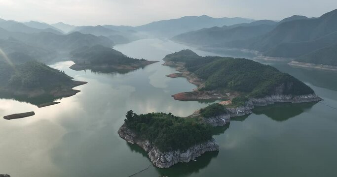 green mountains and river in mist