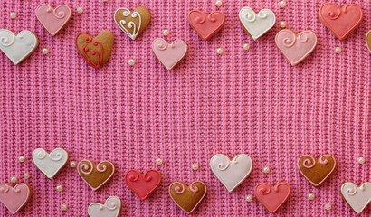 Gingerbread Hearts on a Pink Fabric Sweater. A love decoration. Valentine's Day background. View...