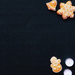 Gingerbread and Christmas tree branches on a dark paper craft background. Happy New Year Banner