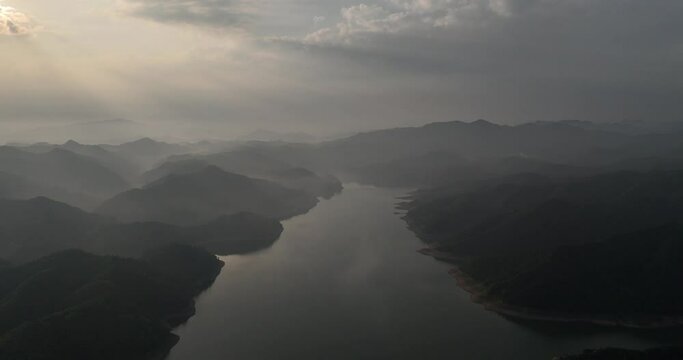green mountains and river in mist
