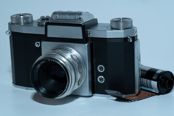 old analog slr camera from front - on white background