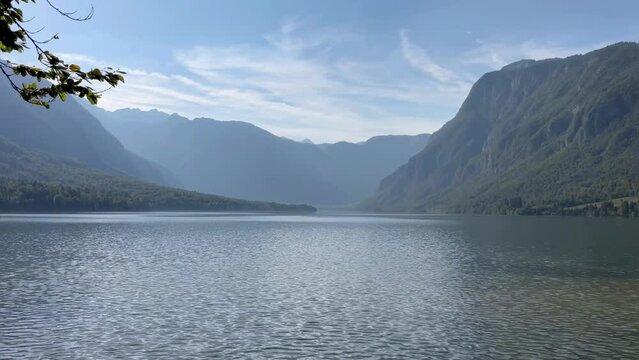 Beautiful view of Lake Bohinj in Slovenia on a clear sunny day.