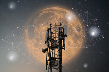 5G mobile communications, mobile phone mast in the night sky in front of a bright blood moon. Network structure with docking points symbolizes the global network.
