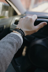 Leather bracelet on the male driver hand