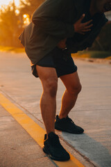Athlete runner feet running on road, Jogging concept at outdoors. Man running for exercise..Athlete runner feet running on road, Jogging concept at outdoors. Man running for exercise.