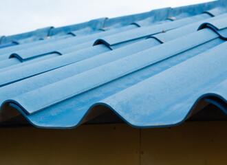 Prefabricated blue tile roof in simple house construction.