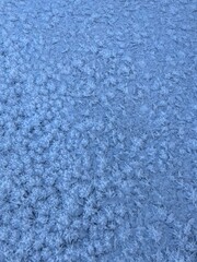 Winter blue natural background. Snow frosty patterns