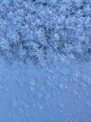 Winter blue natural background. Snow frosty patterns
