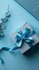Stylish blue gift box with a satin ribbon, cool tones with a hint of winter wonder