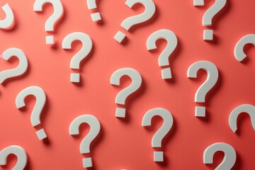 Bright red backdrop with white question marks, hemes of inquiry, uncertainty, and problem solving