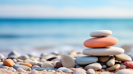Fototapeta na wymiar Zen Stones Balanced on Beach Shoreline Against Calm Sea