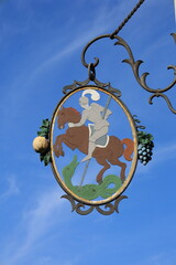 Fototapeta na wymiar Werbetafel vor blauem Himmel in Romanshorn am Bodensee
