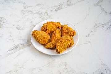 Fried chicken pieces on a White Background