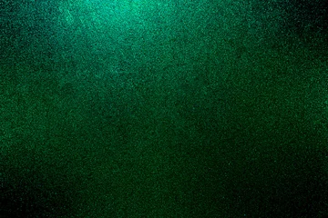 Poster green black glitter texture abstract banner background with space. Twinkling glow stars effect. Like outer space, night sky, universe. Rusty, rough surface, grain. © Sumeth