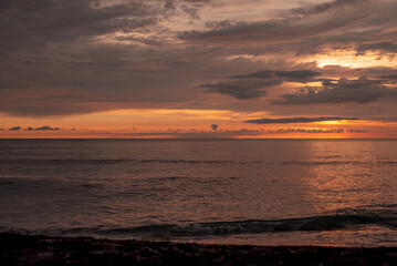 Beautiful view of the sea sunset. Orange evening sky.