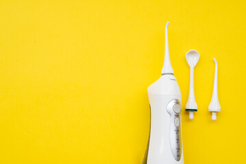 Mouth aerator on a yellow background with different nozzles. View from above - obrazy, fototapety, plakaty