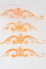 repeating orange color pencil decor shapes on tracing paper