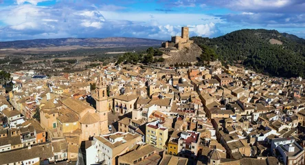 Foto op Plexiglas medieval Town Biar in Spain and castle. Sierra de Mariola in the Vinalopo Valley in the province of Alicante . aerial drone panoramic view © Freesurf