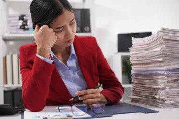 Asian and African office workers trying to feel bored, unhappy and bored working in the office....