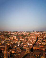 Fototapeta na wymiar Bologna in the morning light from above, view from the sky, city landscape panoramic low sun view, Italian architecture from drone