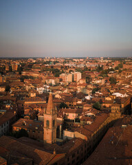 Fototapeta premium Bologna in the morning light from above, view from the sky, city landscape panoramic low sun view, Italian architecture from drone