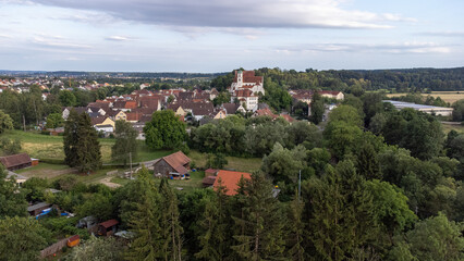 Fototapeta na wymiar Scheer on the Danube river with St. Nicholas Church, taken from the air, drone image