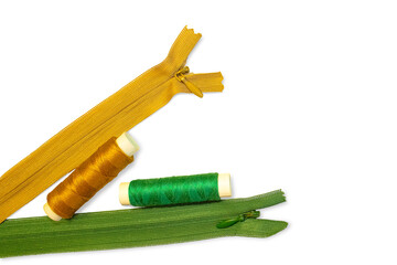 Two sewing zippers and two skeins of thread isolated on a transparent background.