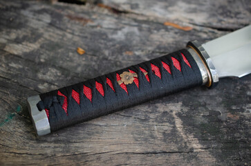 Red and black colure with tanto knife handle wraping