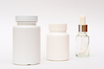 Fototapeta na wymiar Medicine white pill bottles on a white background