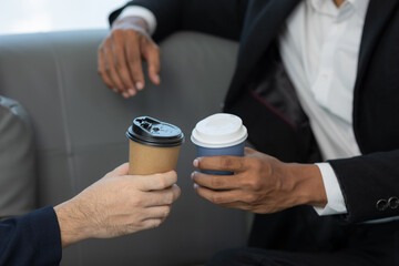 Close up of a team of business people having a meeting to analyze data for a marketing plan.