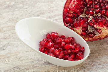 Ripe red Pomegranate seeds in the bowl