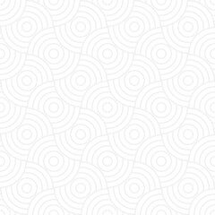 Seamless trendy pattern of circles and arcs, geometric white shapes for textiles and wallpaper. Festive Christmas pattern on a gray background.