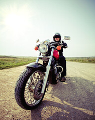 Obraz premium Biker on the country road