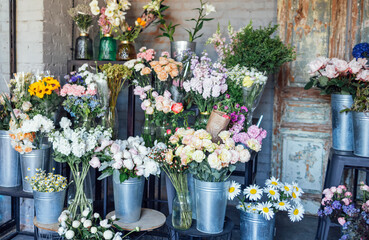 Showcase of a flower shop with large assortment in retro style.