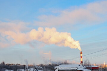 Smoke from a factory chimney. Ecological pollution. Air emissions polluting forest. Industrial...