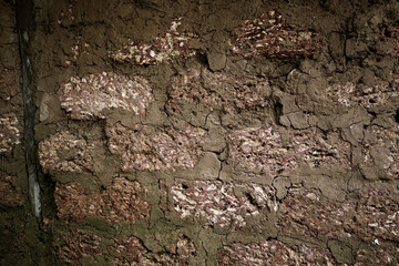 Empty Old Brick Wall Texture. Painted Distressed Wall Surface. Grungy Wide Brick wall. Grunge Red Stonewall Background. Shabby Building Facade With Damaged Plaster. Abstract Web Banner.