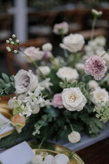Bunch of flower on a long table setting decoration for wedding or engagement ceremony in a sunny day