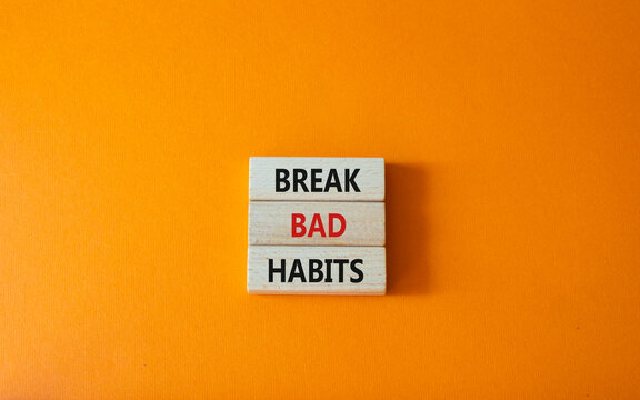 Break bad habits symbol. Concept words Break bad habits on wooden blocks. Beautiful orange background. Medicine and Break bad habits concept. Copy space.