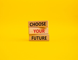 Choose your future symbol. Wooden blocks with words Choose your future. Beautiful yellow background. Business and Choose your future concept. Copy space.