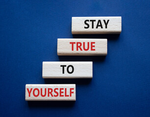 Stay True to Yourself symbol. Wooden blocks with words Stay True to Yourself. Beautiful deep blue background. Business and Stay True to Yourself concept. Copy space.